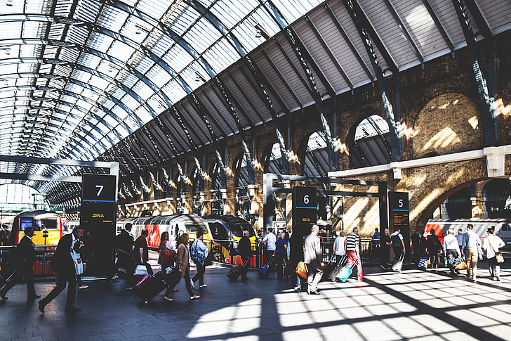 Train passengers at a busy railway station at Kings Cross in Central London. Image captured with a Canon 6D DSLR