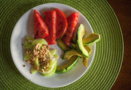 sliced avocado and watermelon on white ceramic plate