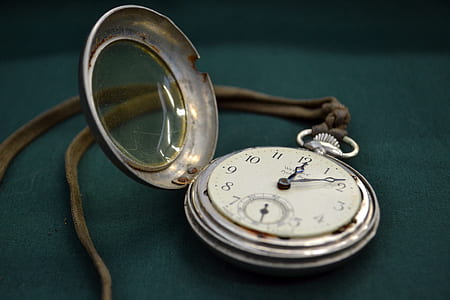silver-colored pocket watch