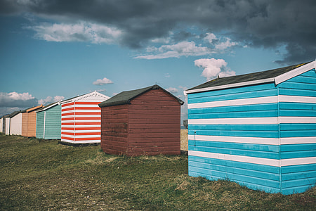 Wide angle shot of colourful beach huts on the coast of Kent in England. Image captured with a Canon 5D