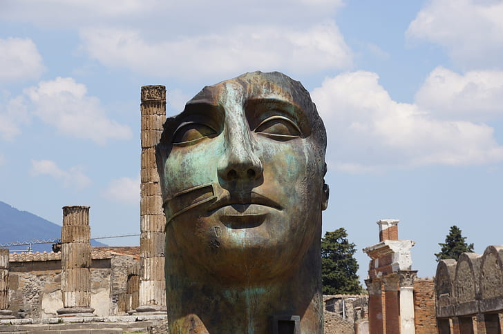 grey and blue statue head