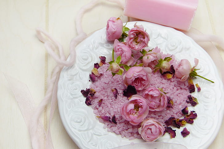 purple multi-petaled flowers on round white ceramic plate