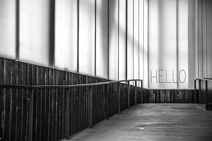 grayscale photograph of hello wall art