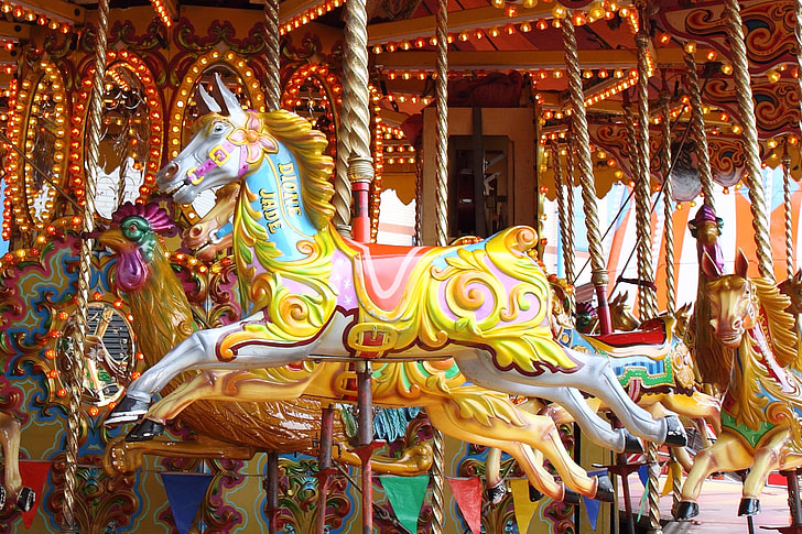 white-and-multicolored horse carousel
