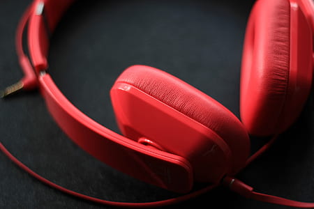 photo of red corded headphones