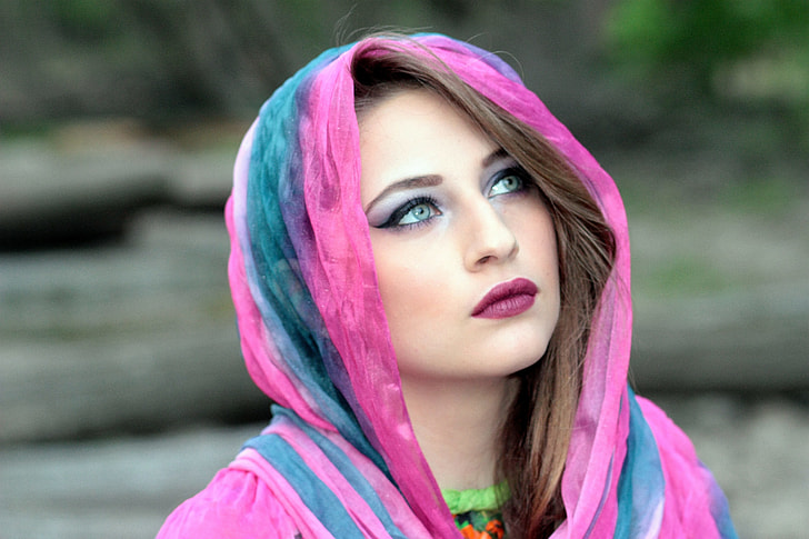 woman in pink and green hijab scarf