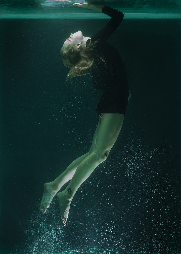 Royalty-Free photo: Person under water wearing black wet suit | PickPik