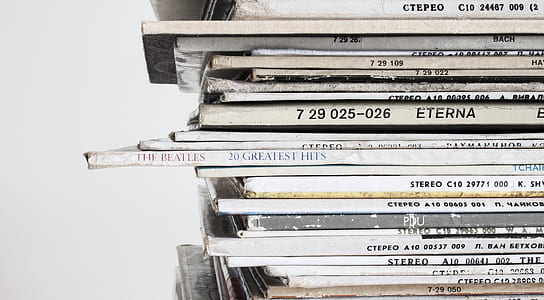 Piled Vinyl Records With White Background