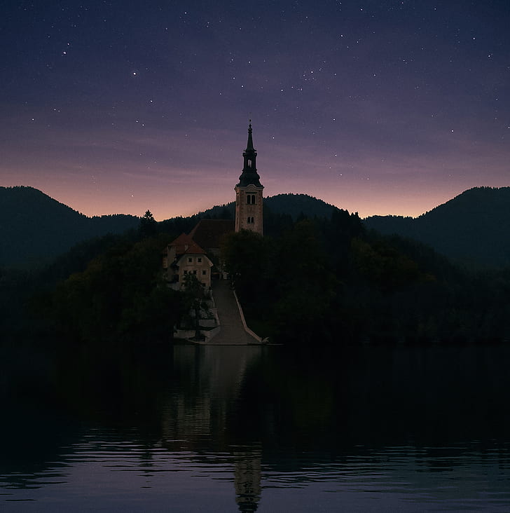 photography of castle near in lake
