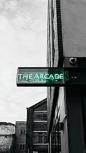 selective colored of green The Arcade neon light signboard