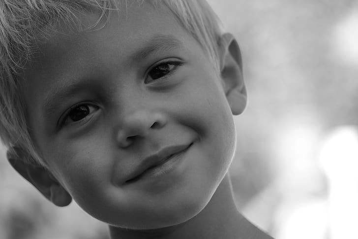 grayscaled photo of boy