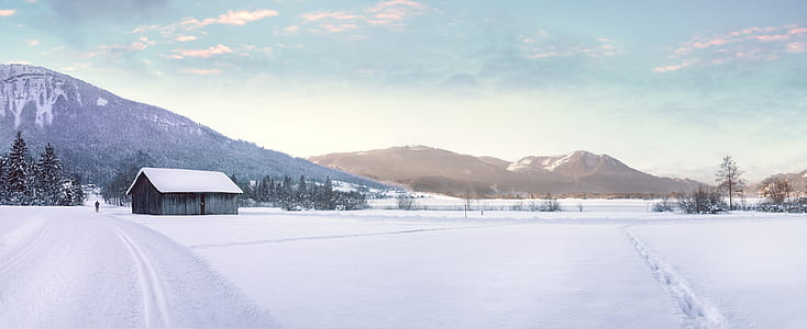 Snow Covered Landscape Against Mountain Range
