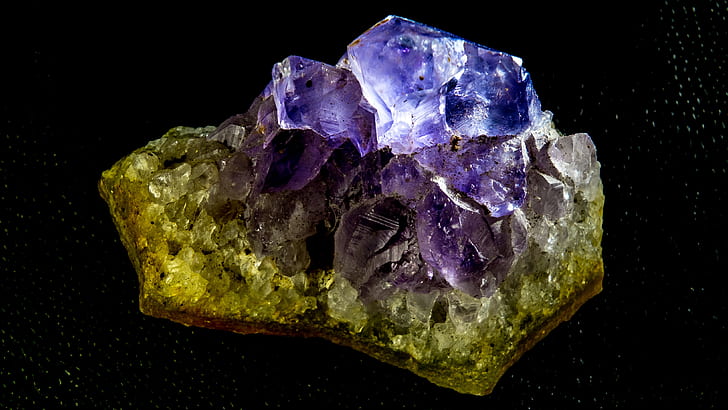 closeup photo of green and purple geode stone