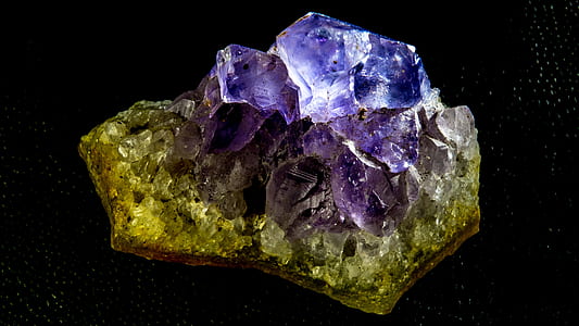 closeup photo of green and purple geode stone