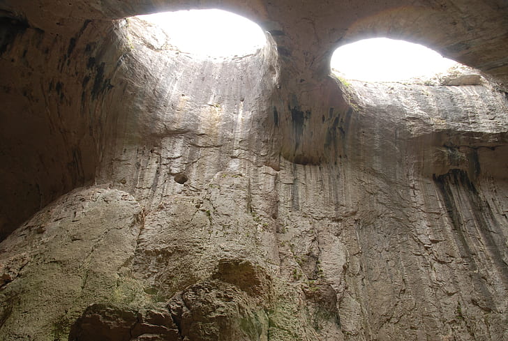 low angle photo of cave at daytime