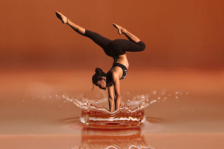 shallow focus photography of woman doing yoga