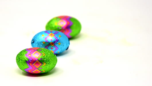 three multicolored Easter eggs