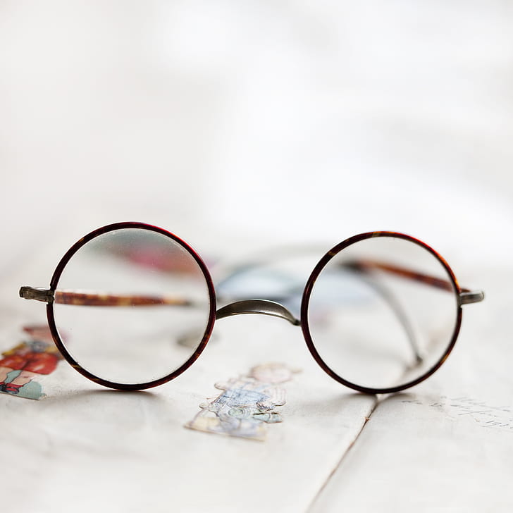 photo of round eyeglasses with brown frames