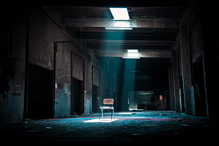 Chair on Abandoned Place With a Spotlight Coming from Outside