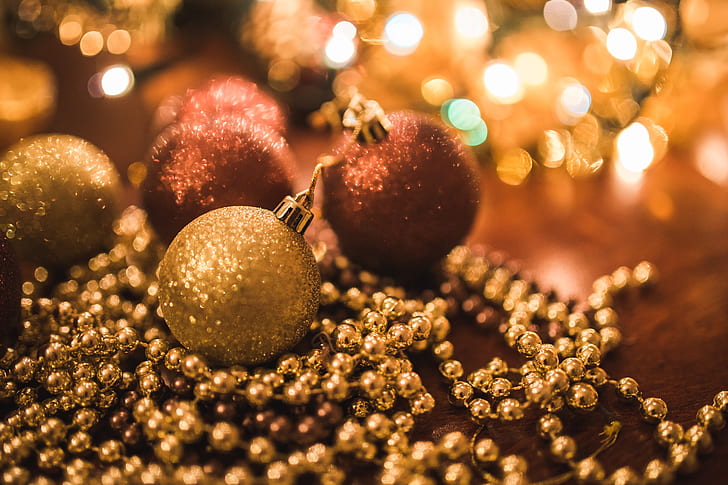 selective focus photo of gold baubles