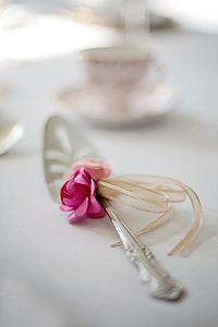 selective focus photo of stainless steel utensil with flower-accent