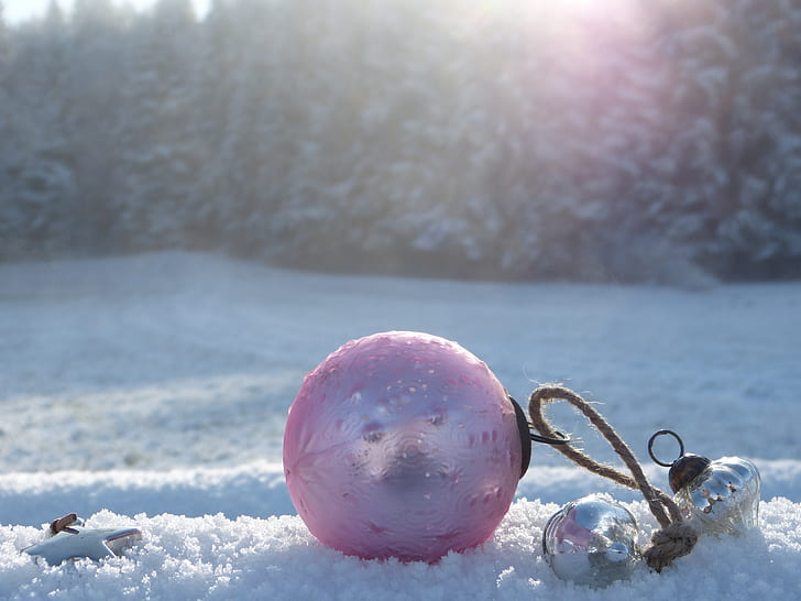 pink ball on snowfield