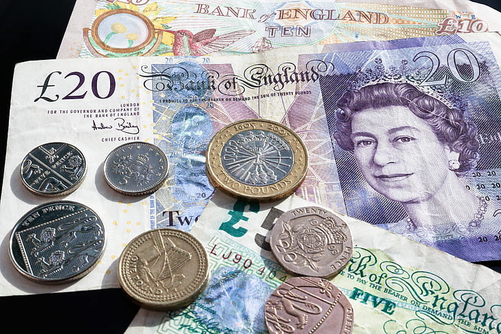 closeup of British coin pound banknotes
