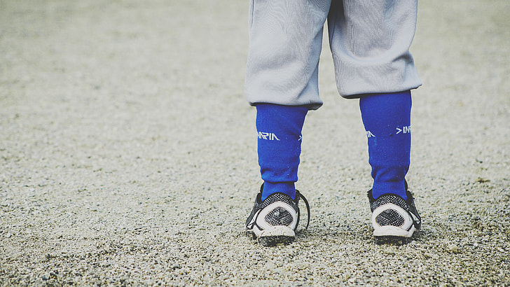 person wearing blue socks and black-and-white shoes