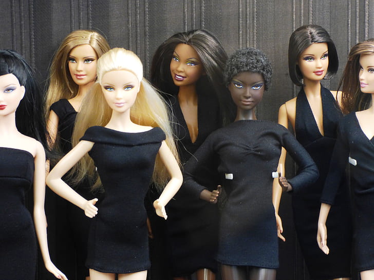 photography of dolls in black dresses