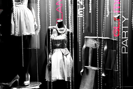 grayscale photo of mannequins with dress