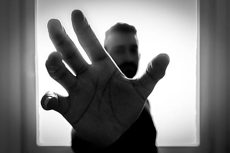 selective photography of man's right hand