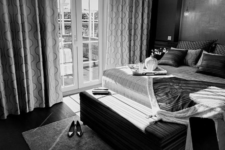 grayscale photo of bedroom