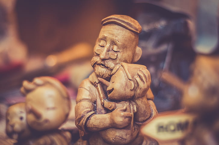 shallow focus photography of Pinocchio carving