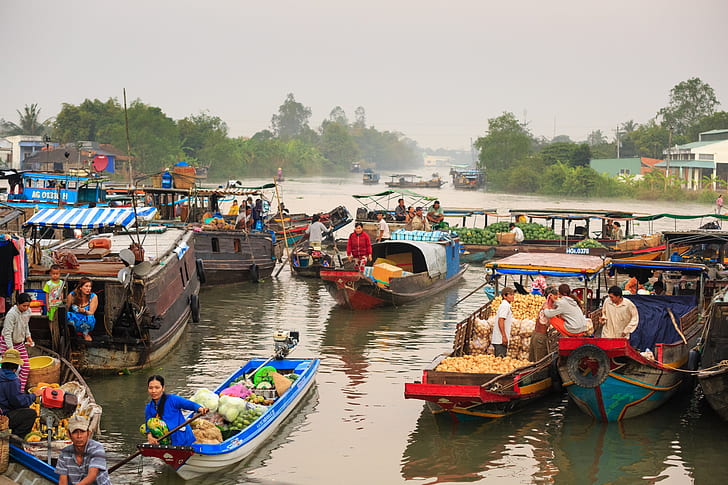 group of people inside boats during daytime