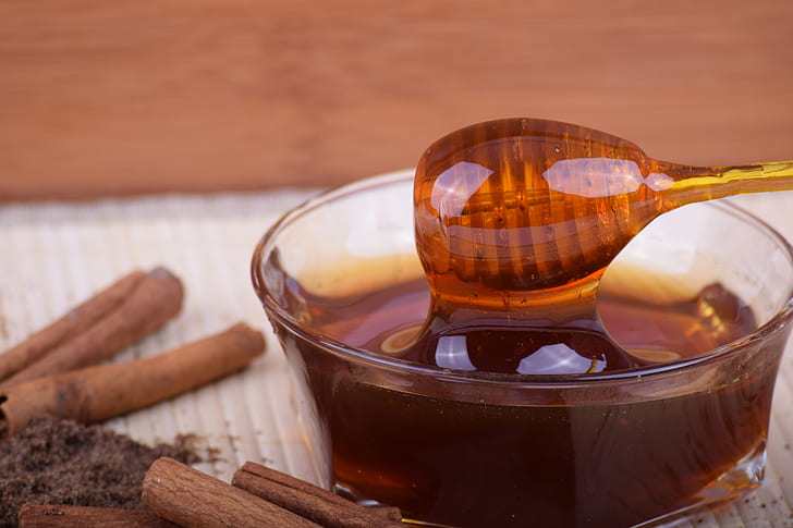 honey in clear glass bowl