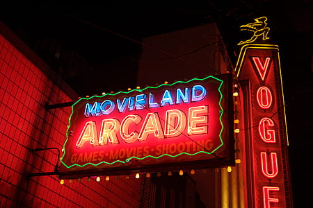 blue and red Movieland Arcade neon signage