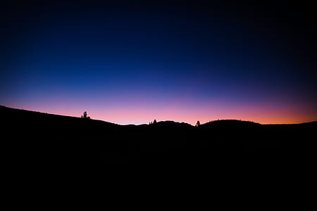 silhouette photo of mountain during golden hour