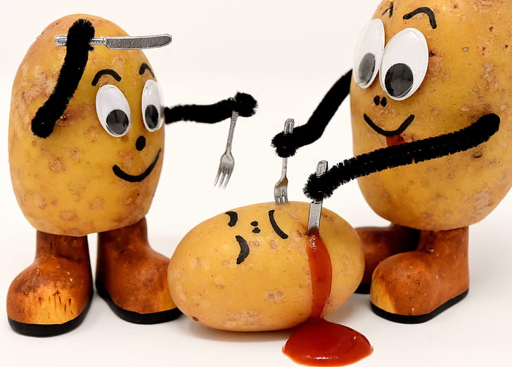 three potatoes holding knife