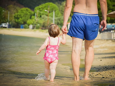 man walking in beach with a girl