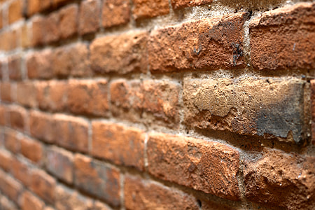 shallow focus photography of brown brick