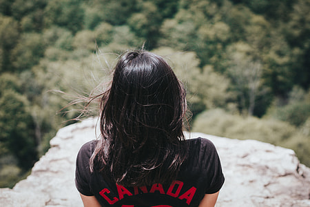 woman in black Canada shirt in mountain