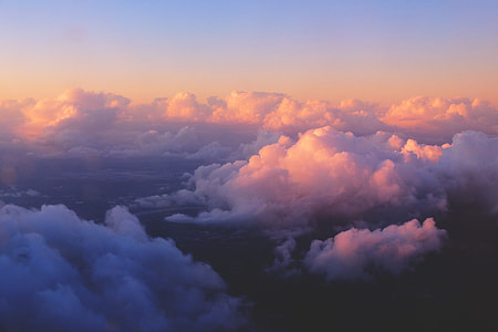 Aerial shot capturing the clouds in the sky at sunset