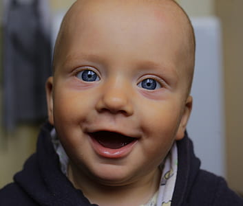 toddler smiling wearing black shirt