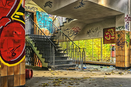 black concrete stairs near wall with graffiti
