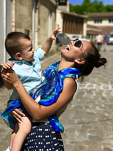 woman carrying a toddler
