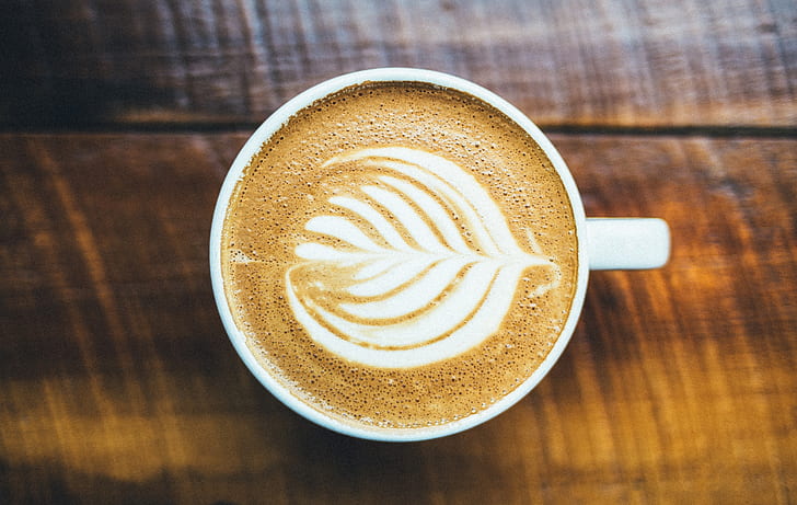 cappuccino in white ceramic closeup photo