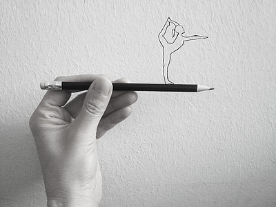 person holding pencil
