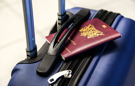 passport on blue travel luggage