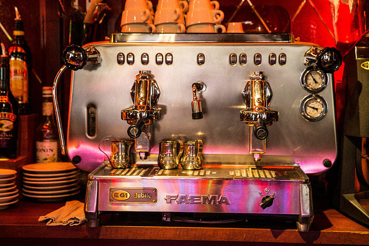 An expresso coffee machine sits in a bar cafe in Central Paris, France. Image captured with a Canon 6D