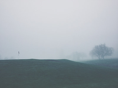 landscape photo of foggy grass field